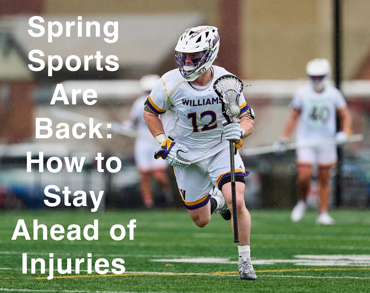 A lacrosse player in full protective gear running down the field during a spring game.